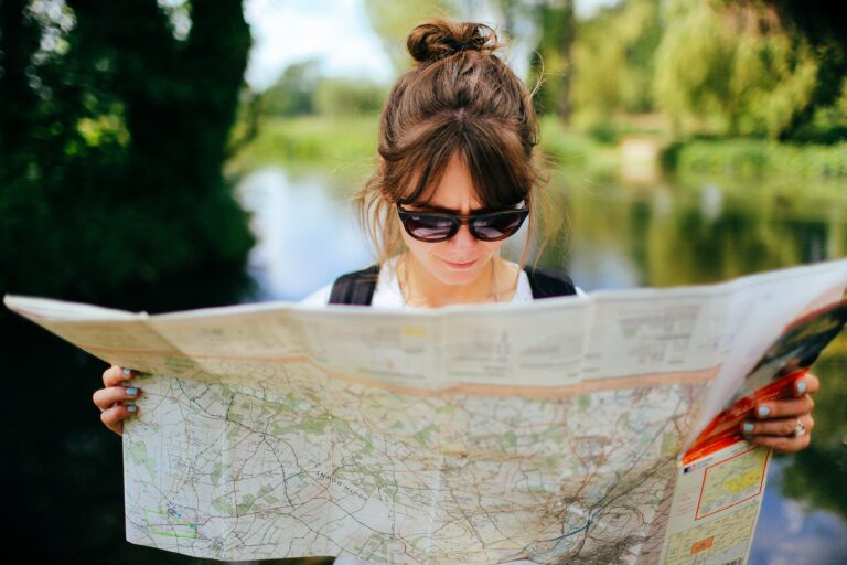 woman looking at map on self-discovery journey