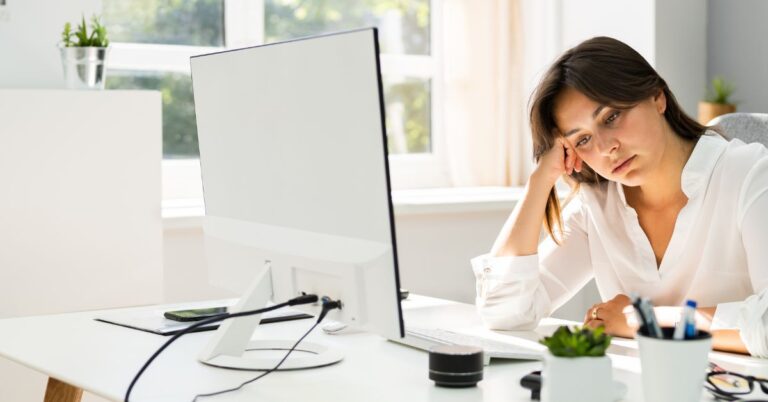 Women at work desk feeling down