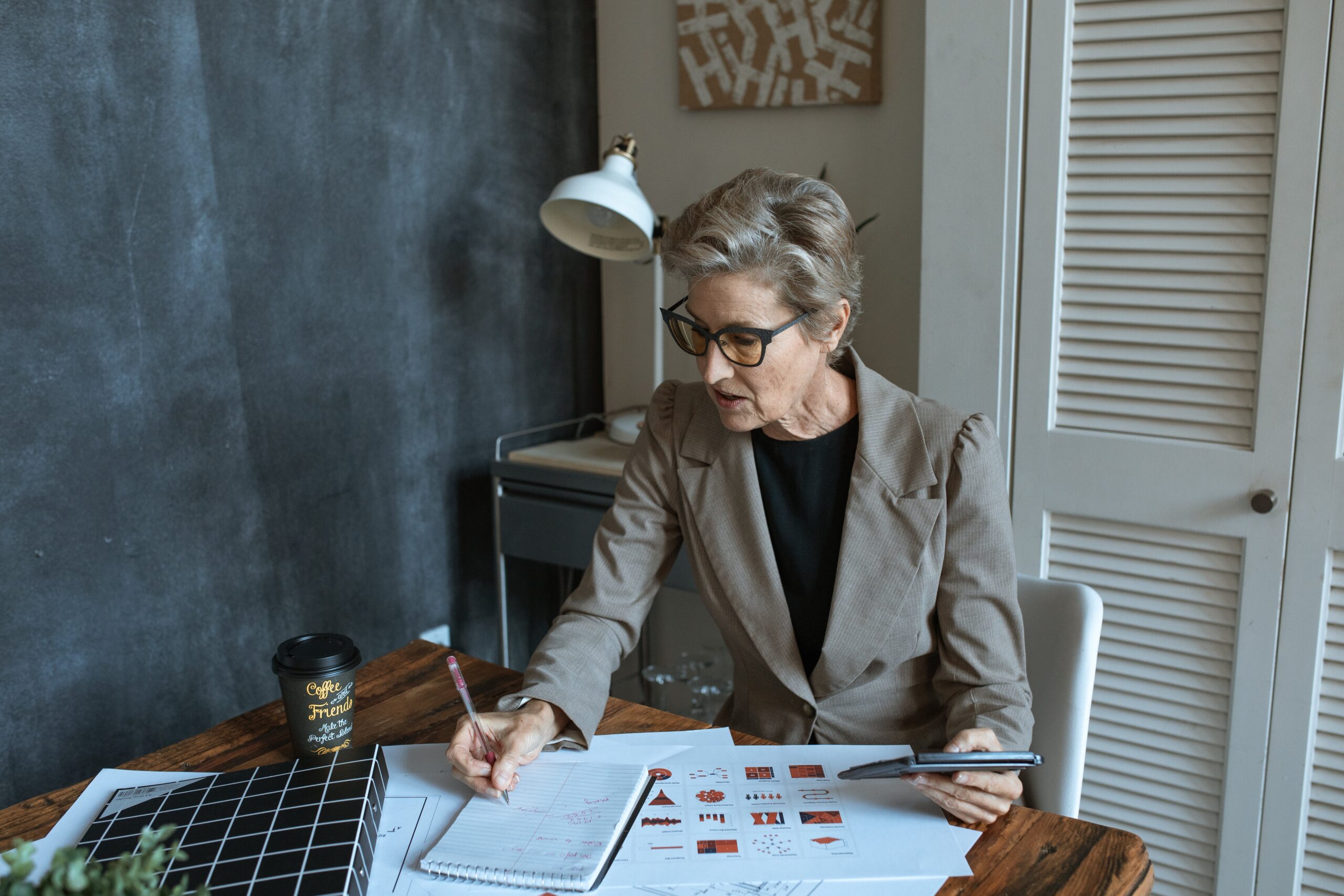 woman at desk writing