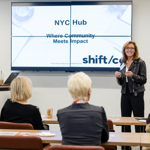 Entrepreneur Training Smiling Shift/Co presenter discussing the NYC hub