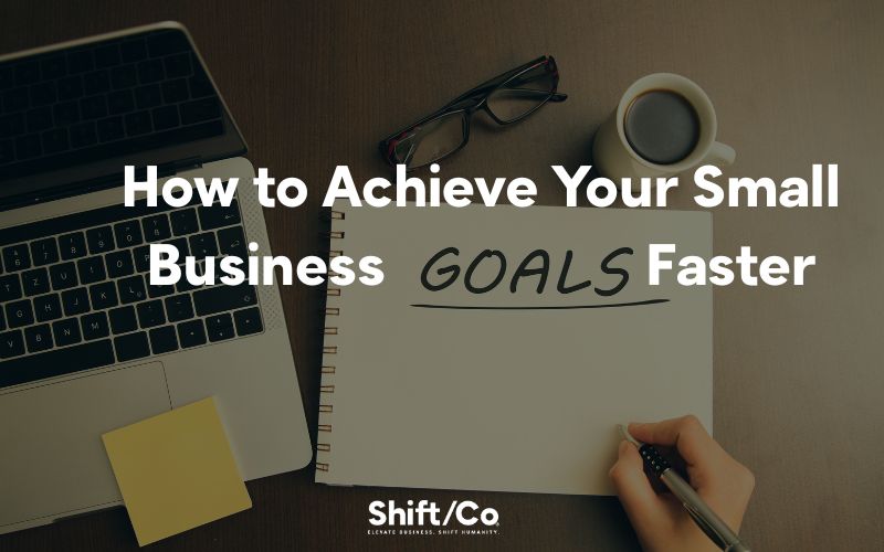 Desk with a notebook labeled ‘Goals,’ laptop, and coffee, symbolizing strategies for achieving small business goals and company goals faster.